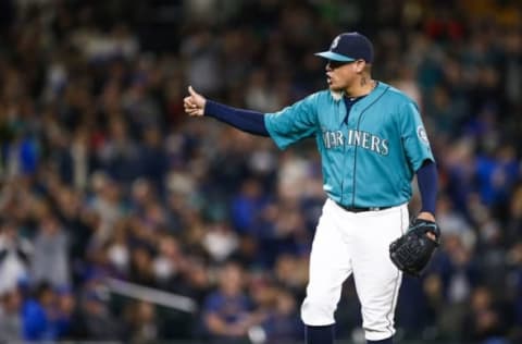 Apr 29, 2016; Seattle, WA, USA; Seattle Mariners starting pitcher Felix Hernandez (34) walks to the dugout after being relieved during the eighth inning against the Kansas City Royals at Safeco Field. Mandatory Credit: Joe Nicholson-USA TODAY Sports