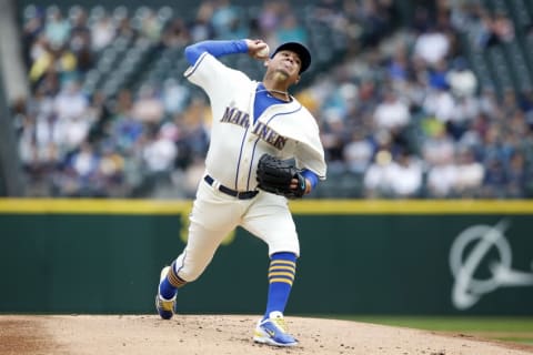 Apr 10, 2016; Seattle, WA, USA; Seattle Mariners starting pitcher Felix Hernandez (34) throws out a pitch in the first inning against the Oakland Athletics at Safeco Field. Mandatory Credit: Jennifer Buchanan-USA TODAY Sports