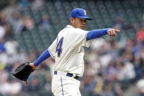 Seattle Mariners starting pitcher Felix Hernandez (34) points towards home plate against the Oakland Athletics at Safeco Field. Mandatory Credit: Jennifer Buchanan-USA TODAY Sports