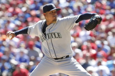 Apr 4, 2016; Arlington, TX, USA; Seattle Mariners starting pitcher Felix Hernandez (34) throws a pitch in the first inning against the Texas Rangers at Globe Life Park in Arlington. Mandatory Credit: Tim Heitman-USA TODAY Sports