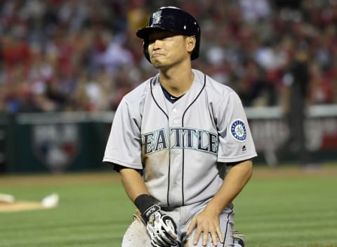 April 22, 2016; Anaheim, CA, USA; Seattle Mariners left fielder Norichika Aoki (8) reacts after being picked off at first in the second inning against Los Angeles Angels at Angel Stadium of Anaheim. Mandatory Credit: Richard Mackson-USA TODAY Sports