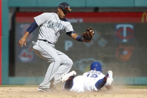 Apr 4, 2016; Arlington, TX, USA; Texas Rangers second baseman Rougned Odor (12) steals second base in the fifth inning against Seattle Mariners shortstop Ketel Marte (4) at Globe Life Park in Arlington. Mandatory Credit: Tim Heitman-USA TODAY Sports