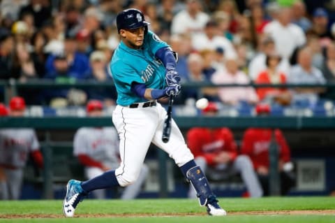 May 13, 2016; Seattle, WA, USA; Seattle Mariners shortstop Ketel Marte (4) connects with a bases clearing triple in the sixth inning against the Los Angeles Angels at Safeco Field. Three runs would score. Mandatory Credit: Jennifer Buchanan-USA TODAY Sports