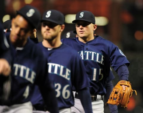 May 17, 2016; Baltimore, MD, USA; Seattle Mariners third baseman Kyle Seager (15) high fives teammates after beating the Baltimore Orioles 10-0 at Oriole Park at Camden Yards. Mandatory Credit: Evan Habeeb-USA TODAY Sports