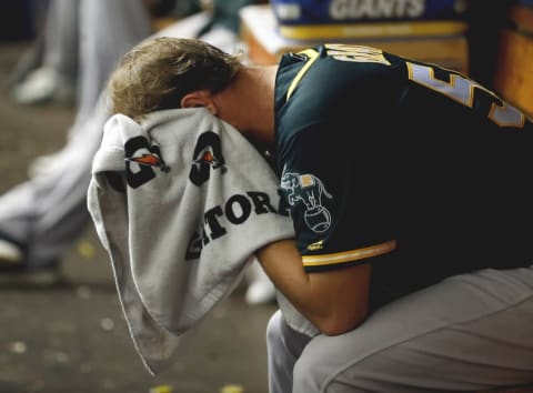 May 15, 2016; St. Petersburg, FL, USA; Oakland Athletics starting pitcher Sonny Gray (54) looks down as he reacts in the dugout after he pitched the second inning against the Tampa Bay Rays at Tropicana Field. Mandatory Credit: Kim Klement-USA TODAY Sports