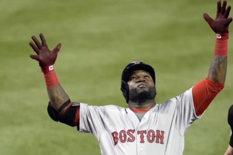 Jun 2, 2016; Baltimore, MD, USA; Boston Red Sox designated hitter David Ortiz (34) celebrates after hitting a three run home run during the sixth inning against the Baltimore Orioles at Oriole Park at Camden Yards. Mandatory Credit: Tommy Gilligan-USA TODAY Sports