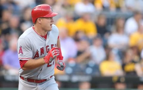 Jun 3, 2016; Pittsburgh, PA, USA; Los Angeles Angels center fielder Mike Trout (27) runs to first base with an RBI single against the Pittsburgh Pirates during the first inning at PNC Park. Mandatory Credit: Charles LeClaire-USA TODAY Sports