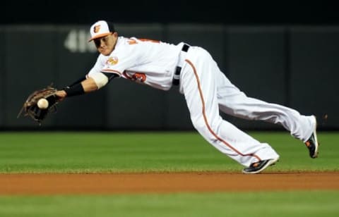 Jun 6, 2016; Baltimore, MD, USA; Baltimore Orioles shortstop Manny Machado (13) dives for a ground ball in the seventh inning against the Kansas City Royals at Oriole Park at Camden Yards. The Baltimore Orioles won 4-1. Mandatory Credit: Evan Habeeb-USA TODAY Sports