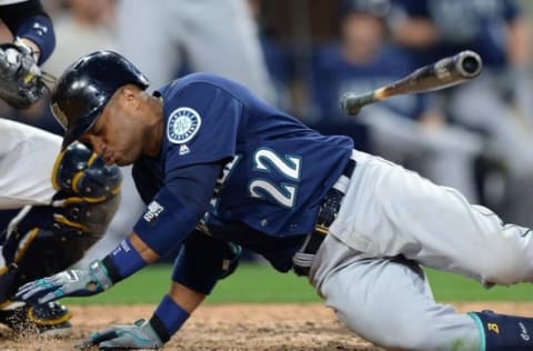 Jun 2, 2016; San Diego, CA, USA; Seattle Mariners second baseman Robinson Cano (22) reacts after being hit in the wrist by a pitch during the seventh inning against the San Diego Padres at Petco Park. Mandatory Credit: Jake Roth-USA TODAY Sports