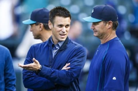 Apr 25, 2016; Seattle, WA, USA; Seattle Mariners manager Scott Servais (9, right) talks with general manager Jerry Dipoto during batting practice before a game against the Houston Astros at Safeco Field. Mandatory Credit: Joe Nicholson-USA TODAY Sports