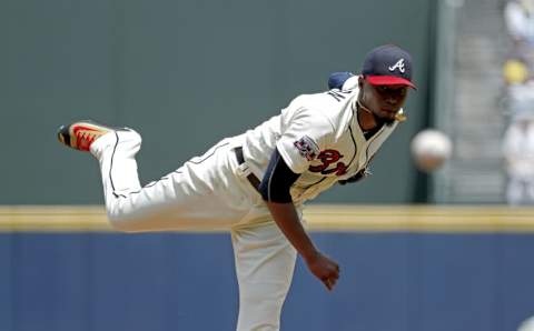 Jul 17, 2016; Atlanta, GA, USA; Atlanta Braves starting pitcher Julio Teheran (49) delivers a pitch to a Colorado Rockies batter in the first inning of their game at Turner Field. Mandatory Credit: Jason Getz-USA TODAY Sports