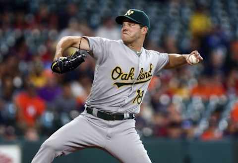 Jul 7, 2016; Houston, TX, USA; Oakland Athletics starting pitcher Rich Hill (18) delivers a pitch during the first inning against the Houston Astros at Minute Maid Park. Mandatory Credit: Troy Taormina-USA TODAY Sports