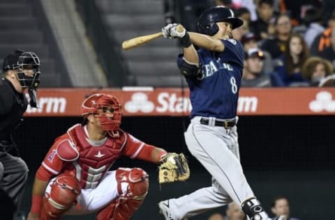 Sep 13, 2016; Anaheim, CA, USA; Seattle Mariners left fielder Nori Aoki (8) follows through on his swing for a solo home run during the second inning against the Los Angeles Angels at Angel Stadium of Anaheim. Mandatory Credit: Richard Mackson-USA TODAY Sports