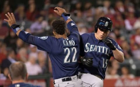 Sep 14, 2016; Anaheim, CA, USA; Seattle Mariners third baseman Kyle Seager (15) celebrates with second baseman Robinson Cano (22) after hitting a solo home run in the fifth inning against the Los Angeles Angels of Anaheim during a MLB game at Angel Stadium of Anaheim. Mandatory Credit: Kirby Lee-USA TODAY Sports