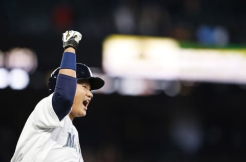 Apr 13, 2016; Seattle, WA, USA; Seattle Mariners pinch hitter Dae-Ho Lee (10) reacts after hitting a walk-off two-run home run against the Texas Rangers during the tenth inning at Safeco Field. Seattle defeated Texas, 4-2. Mandatory Credit: Joe Nicholson-USA TODAY Sports