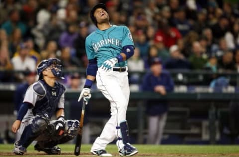 May 27, 2016; Seattle, WA, USA; Seattle Mariners second baseman Robinson Cano (22) reacts after hitting a pop-fly for an out against the Minnesota Twins during the sixth inning at Safeco Field. Mandatory Credit: Jennifer Buchanan-USA TODAY Sports