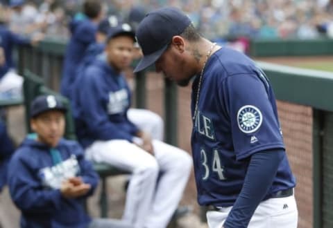 Sep 5, 2016; Seattle, WA, USA; Seattle Mariners starting pitcher Felix Hernandez (34) returns to the dugout after being relieved during the sixth inning against the Texas Rangers at Safeco Field. Seattle defeated Texas, 14-6. Mandatory Credit: Joe Nicholson-USA TODAY Sports