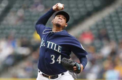 Sep 5, 2016; Seattle, WA, USA; Seattle Mariners starting pitcher Felix Hernandez (34) throws against the Texas Rangers during the third inning at Safeco Field. Mandatory Credit: Joe Nicholson-USA TODAY Sports