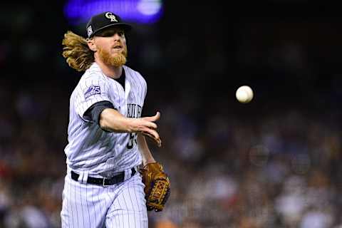 DENVER, CO – JULY 14: Jon Gray of the Rockies lobs the ball to first in a game against the Mariners. (Photo by Dustin Bradford/Getty Images)