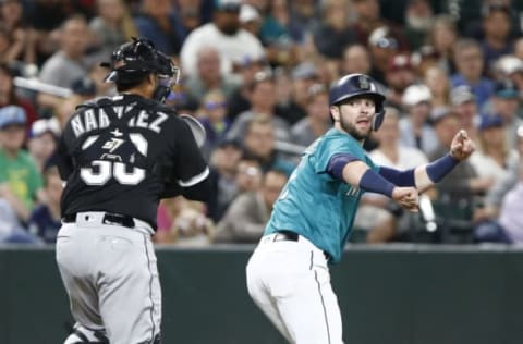 SEATTLE, WA – JULY 20: Mitch Haniger #17 of the Seattle Mariners tries to outrun Omar Narvaez #38 of the Chicago White Sox but is tagged out in the eighth inning at Safeco Field on July 20, 2018 in Seattle, Washington. (Photo by Lindsey Wasson/Getty Images)