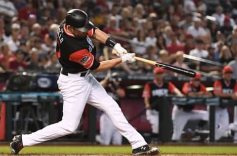 PHOENIX, AZ – AUGUST 26: A.J. Pollock #11 of the Arizona Diamondbacks hits a sacrifice fly ball during the third inning of the MLB game against the Seattle Mariners at Chase Field on August 26, 2018, in Phoenix, Arizona. All players across MLB wear nicknames on their backs as well as colorful, non-traditional uniforms featuring alternate designs inspired by youth-league uniforms during Players Weekend. (Photo by Jennifer Stewart/Getty Images)