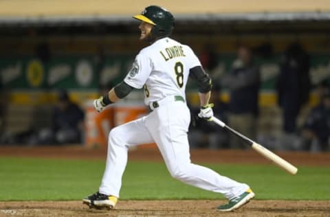 OAKLAND, CA – AUGUST 30: Jed Lowrie #8 of the Oakland Athletics hits an rbi single scoring Marcus Semien #10 against the Seattle Mariners in the bottom of the eighth inning at Oakland Alameda Coliseum on August 30, 2018, in Oakland, California. (Photo by Thearon W. Henderson/Getty Images)