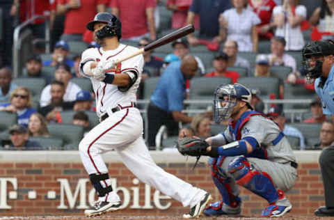 ATLANTA, GA – OCTOBER 08: Pinch-hitter Kurt Suzuki #24 of the Atlanta Braves hits a two-run RBI single during the fourth inning of Game Four of the National League Division Series against the Los Angeles Dodgers at Turner Field on October 8, 2018, in Atlanta, Georgia. (Photo by Rob Carr/Getty Images)