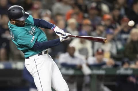 SEATTLE, WA – APRIL 12: Domingo Santana #16 of the Seattle Mariners hits a two-run single off of starting pitcher Wade Miley #20 of the Houston Astros to score Mitch Haniger #17 of the Seattle Mariners and Mallex Smith #0 of the Seattle Mariners during the second inning of a game at T-Mobile Park on April 12, 2019 in Seattle, Washington. (Photo by Stephen Brashear/Getty Images)