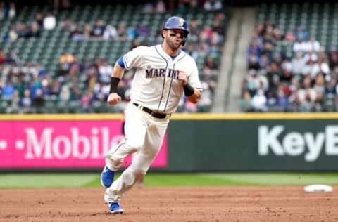 SEATTLE, WA – APRIL 14: Mitch Haniger #17 of the Seattle Mariners scores on a double off the bat of Domingo Santana in the third inning against the Houston Astros at T-Mobile Park on April 14, 2019, in Seattle, Washington. (Photo by Abbie Parr/Getty Images)