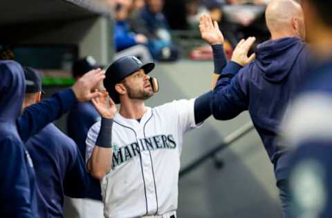 SEATTLE, WA – APRIL 25: Mitch Haniger #17 of the Seattle Mariners is greeted in the dugout after scoring on a single by Tim Beckham #1 in the first inning against the Texas Rangers at T-Mobile Park on April 25, 2019 in Seattle, Washington. (Photo by Lindsey Wasson/Getty Images)