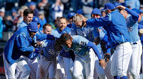 KANSAS CITY, MISSOURI – APRIL 14: Hunter Dozier #17 and Terrance Gore of the Kansas City Royals celebrate with teammates after Dozier hit the game winning single to score Gore from third in the ninth inning for a 9-8 win against the Cleveland Indians during the game at Kauffman Stadium on April 14, 2019 in Kansas City, Missouri. (Photo by John Sleezer/Getty Images)