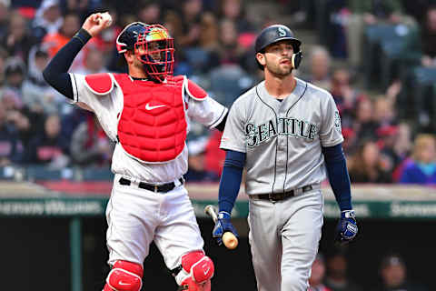 CLEVELAND, OHIO – MAY 03: Catcher Kevin Plawecki #27 of the Cleveland Indians returns the ball as Mitch Haniger #17 of the Seattle Mariners walks away after striking out during the third inning at Progressive Field on May 03, 2019 in Cleveland, Ohio. (Photo by Jason Miller/Getty Images)