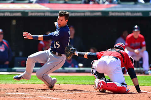 CLEVELAND, OHIO – MAY 05: Dylan Moore #25 of the Seattle Mariners dodges the tag from catcher Kevin Plawecki #27 of the Cleveland Indians to score on a single by Braden Bishop #5 during the fifth inning at Progressive Field on May 05, 2019 in Cleveland, Ohio. (Photo by Jason Miller/Getty Images)