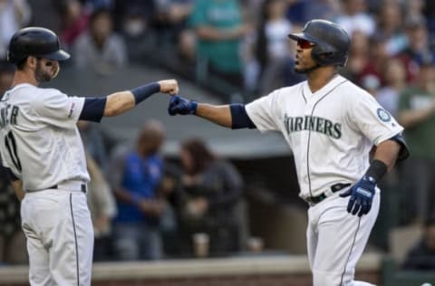 SEATTLE, WA – JUNE 1: Edwin Encarnacion #10 of the Seattle Mariners is congratulated by teammate Mitch Haniger #17 after hitting a two-run home run off of starting pitcher Andrew Heaney #28 of the Los Angeles Angels of Anaheim that also scored Haniger during the sixth inning of a game at T-Mobile Park on June 1, 2019 in Seattle, Washington. (Photo by Stephen Brashear/Getty Images)