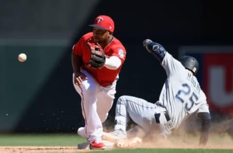 MINNEAPOLIS, MN – JUNE 13: Dylan Moore #25 of the Seattle Mariners slides into second base safely with a two-run double as Jonathan Schoop #16 of the Minnesota Twins fields the ball during the ninth inning of the game on June 13, 2019 at Target Field in Minneapolis, Minnesota. The Twins defeated the Mariners 10-5. (Photo by Hannah Foslien/Getty Images)