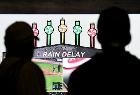 CHICAGO, ILLINOIS – MAY 18: Fans wait out a rain delay during the fifth inning of a game between the Chicago White Sox and the Toronto Blue Jays at Guaranteed Rate Field on May 18, 2019 in Chicago, Illinois. (Photo by David Banks/Getty Images)