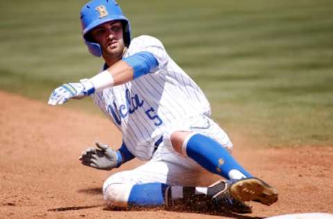 LOS ANGELES, CALIFORNIA – MAY 19: Garrett Mitchell #5 of UCLA slides into third base during a baseball game against the University of Washington at Jackie Robinson Stadium on May 19, 2019, in Los Angeles, California. (Photo by Katharine Lotze/Getty Images)