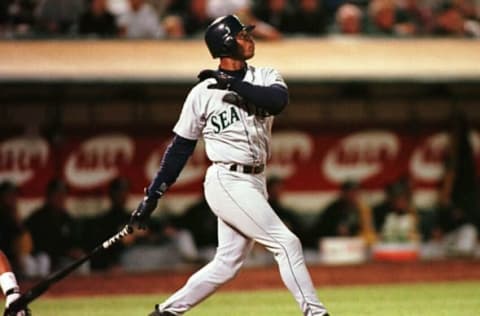 Seattle Mariners Ken Griffey Jr. watches his second home run sail out of the park 22 September against the Oakland Athletics in Oakland, CA. The home run gave Griffey 55 home runs so far this season and only six short of tying the record of 61 in a season by New York Yankees player Roger Maris in 1961. The Mariners defeated the A’s, 4-2. AFP PHOTOS John G. MABANGLO (Photo by JOHN G. MABANGLO / AFP) (Photo credit should read JOHN G. MABANGLO/AFP via Getty Images)