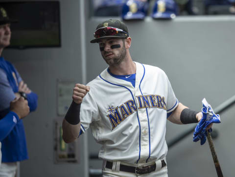 SEATTLE, WA – MAY 19: Mitch Haniger of the Seattle Mariners greets teammates in the dugout. (Photo by Stephen Brashear/Getty Images)