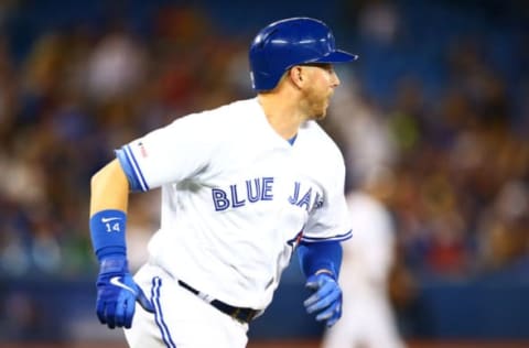 TORONTO, ON – JULY 23: Justin Smoak #14 of the Toronto Blue Jays hits a home run in the ninth inning during a MLB game against the Cleveland Indians at Rogers Centre on July 23, 2019 in Toronto, Canada. (Photo by Vaughn Ridley/Getty Images)