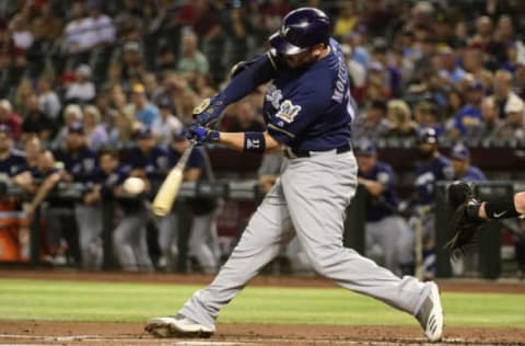 PHOENIX, ARIZONA – JULY 18: Mike Moustakas #11 of the Milwaukee Brewers triples in the second inning of the MLB game against the Arizona Diamondbacks at Chase Field on July 18, 2019 in Phoenix, Arizona. (Photo by Jennifer Stewart/Getty Images)