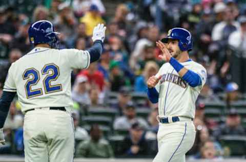 SEATTLE, WA – SEPTEMBER 29: Austin Nola #23 of the Seattle Mariners is congratulated by teammate Omar Narvaez #22 after scoring a run on single by Kyle Lewis #30 of the Seattle Mariners off of starting pitcher Tanner Roark #60 of the Oakland Athletics a during the fifth inning of game at T-Mobile Park on September 29, 2019 in Seattle, Washington. (Photo by Stephen Brashear/Getty Images)