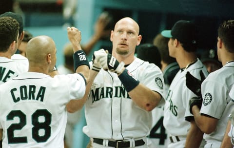 Seattle Mariners OF Jay Buhner is greeted by his teammates after hitting a home-run. AFP PHOTO/Dan Levine (Photo by DAN LEVINE / AFP) (Photo by DAN LEVINE/AFP via Getty Images)