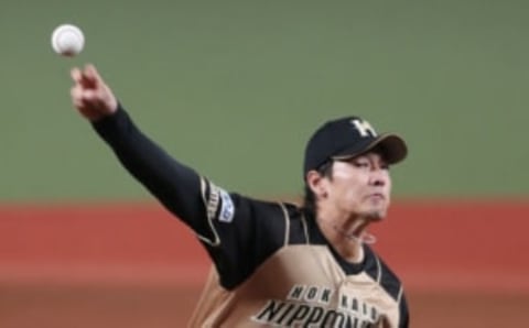 Nippon Ham starter Kohei Arihara pitches the ball. The new Rangers pitchers will face the Seattle Mariners often. (Photo by STR / JIJI PRESS / AFP) / Japan OUT (Photo by STR/JIJI PRESS/AFP via Getty Images)