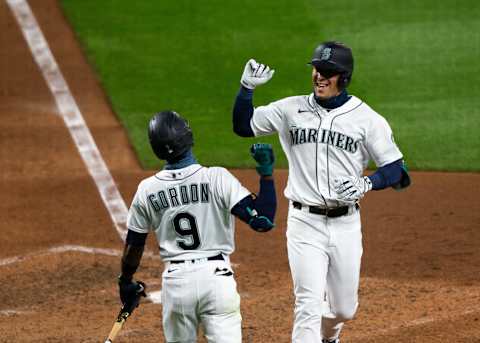 SEATTLE, WA – AUGUST 04: Dylan Moore of the Seattle Mariners is greeted by Dee Gordon after hitting a home run. Avengers. (Photo by Lindsey Wasson/Getty Images)