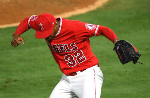 ANAHEIM, CA – JUNE 04: Raisel Iglesias #32 of the Los Angeles Angels celebrates after pitching out of a bases-loaded, no-outs jam in the eighth inning of the game against the Seattle Mariners. (Photo by Jayne Kamin-Once/Getty Images)