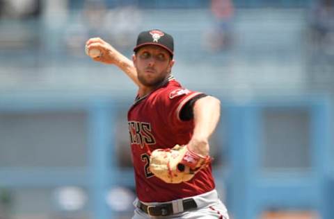 LOS ANGELES, CA – JULY 11: Starting pitcher Merrill Kelly #29 of the Arizona Diamondbacks throws a pitch during the first inning against the Los Angeles Dodgers at Dodger Stadium on July 11, 2021 in Los Angeles, California. (Photo by Kevork Djansezian/Getty Images)