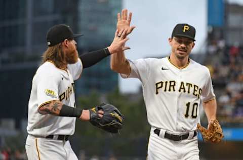 PITTSBURGH, PA – JULY 17: Bryan Reynolds #10 of the Pittsburgh Pirates high fives with Ben Gamel #18 after a double play in the first inning during the game against the New York Mets at PNC Park on July 17, 2021 in Pittsburgh, Pennsylvania. (Photo by Justin Berl/Getty Images)