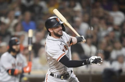 SAN DIEGO, CA – SEPTEMBER 22: Kris Bryant #23 of the San Francisco Giants hits a three RBI double during the first inning of a baseball game against the San Diego Padres at Petco Park on September 22, 2021 in San Diego, California. (Photo by Denis Poroy/Getty Images)