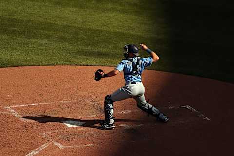 SEATTLE, WASHINGTON – JULY 10: Cal Raleigh of the Seattle Mariners throws the ball to second during summer workouts. (Photo by Abbie Parr/Getty Images)